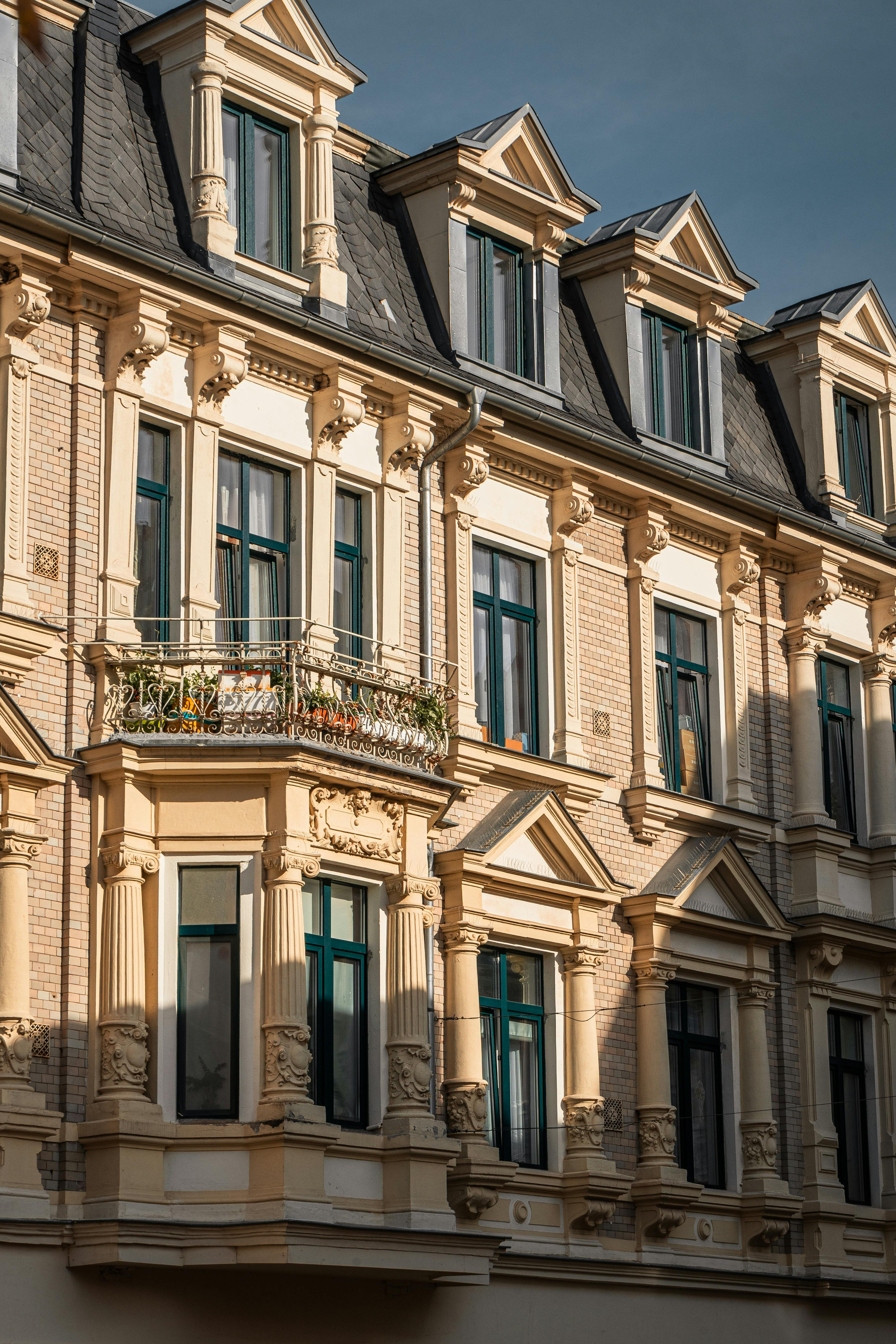 Heritage façade detail with refined wooden windows and calm proportions